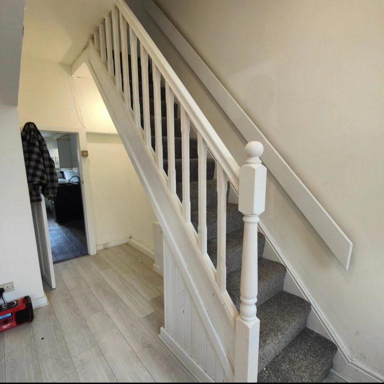 White painted staircase balustrade and newel post fitted by Phix Pro