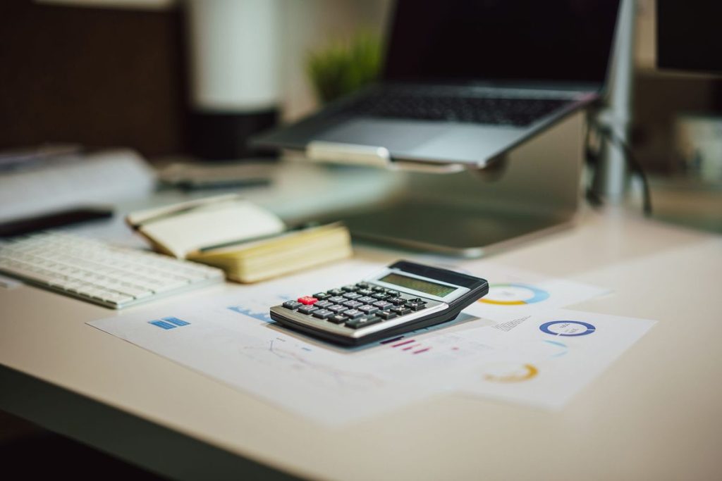 Calculator on paperwork for fair, clear payment