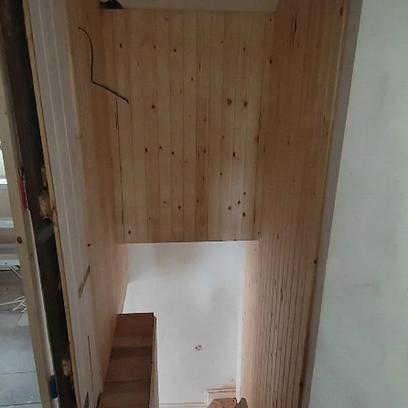 Hidden boiler cupboard lined with tongue and groove timber, built by Phix Pro